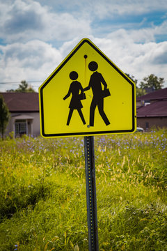 School child crossing warning sign
