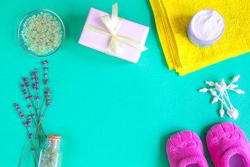 baby accessories with lavender for the bathroom on green background