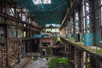 Abandoned, destroyed by war and overgrown machinery of Tkvarcheli power plant 
