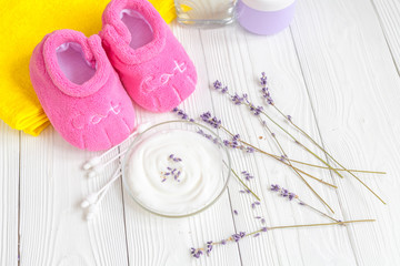 baby organic cream with lavender on shelf in bathroom