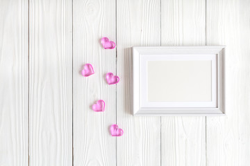 baby shower - blank picture frame on wooden background