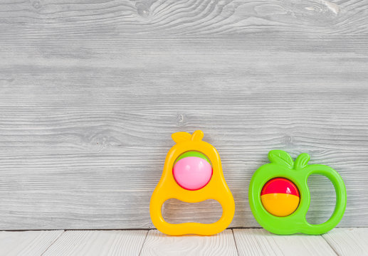 baby rattle on wooden background