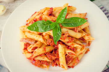 Penne pasta with tuna and basil