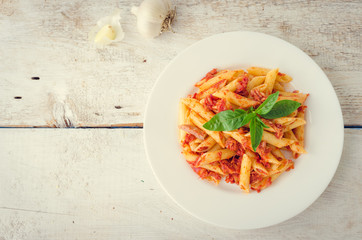 Penne pasta with tuna and basil