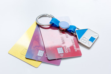 credit cards, key ring - concept mortgage on white background