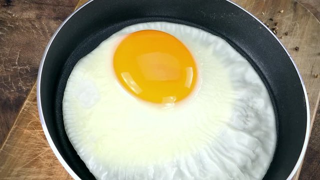 Portion of rotating fried Eggs as not loopable 4K UHD footage