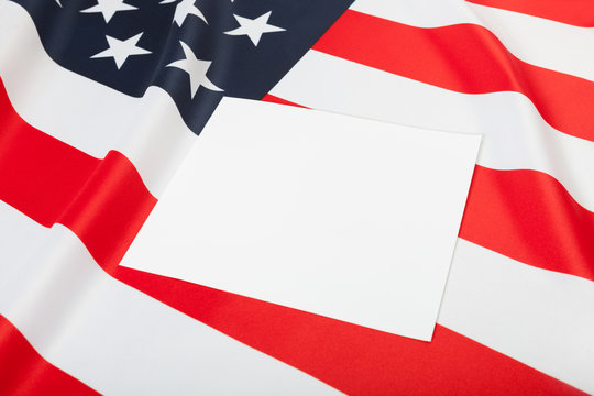 Close of USA ruffled flag with blank text board over it for YOUR TEXT OR IMAGE