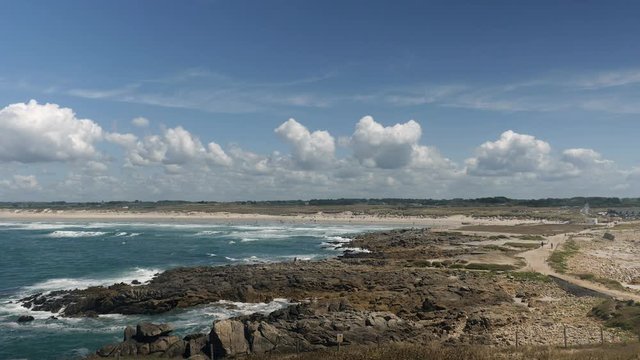 Landscape shot of rocks, sea and beach in Brittany, France on a summer day.