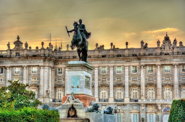 Fototapeta na wymiar Monument to Philip IV in front of the Royal Palace - Madrid, Spain