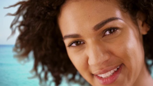 Close-up of Smiling African American woman at the beach