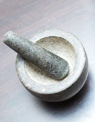 Granite mortar standing on kitchen table