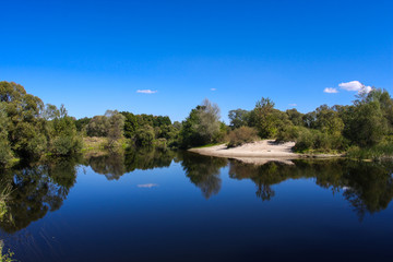 Quiet river bank, clear sunny weather