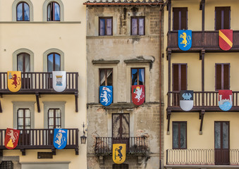 Building with medieval shields at the Piazza Grande in Arezzo