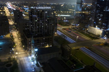 Obraz na płótnie Canvas West Loop, Chicago, USA - Aerial view of the Route 90 at night, while cars passing by, with long exposure.