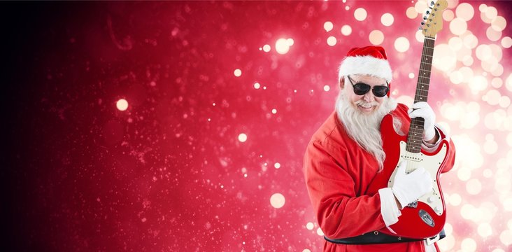 Composite image of cheerful santa claus playing guitar