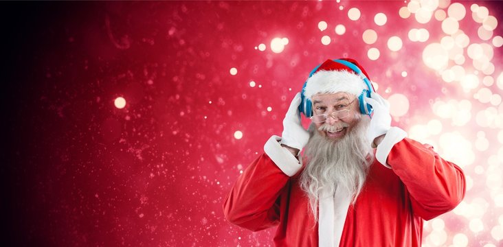 Composite image of portrait of santa claus listening to music on