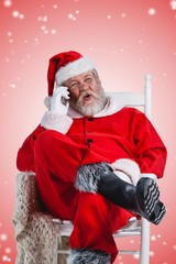 Composite image of excited santa claus talking on mobile phone