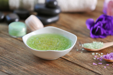 Body scrub and spa treatments on wooden table