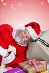 Composite image of high angle view of santa claus sleeping besid