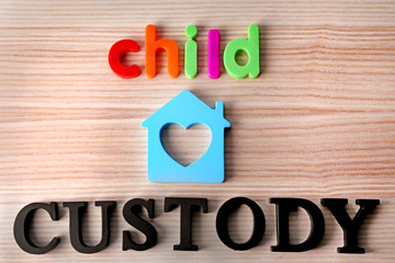 Words CHILD CUSTODY on wooden background, top view