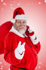 Composite image of portrait of santa claus pointing while carryi
