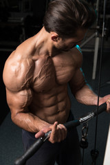 Fototapeta na wymiar Muscular Man Exercising Biceps