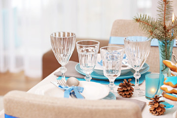 Table served for Hanukkah in living room, closeup