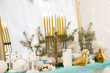 Menorah and decorative elements near mirror. Hanukkah concept