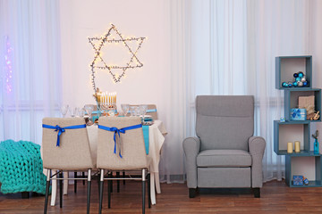 Interior of beautiful living room decorated for Hanukkah