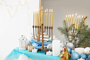 Menorah and decorative elements near mirror. Hanukkah concept