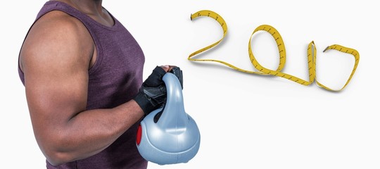 Composite image of fit man exercising with kettlebell