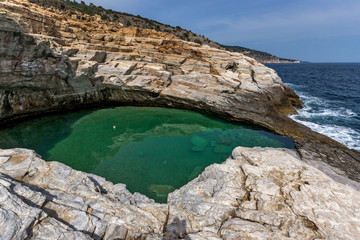 Green waters of Giola Natural Pool in Thassos island, East Macedonia and Thrace, Greece 