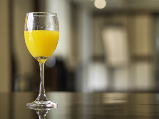 Meeting break with fresh orange juice, bakcground meeting room.