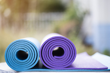 yoga mats on the table in a garden