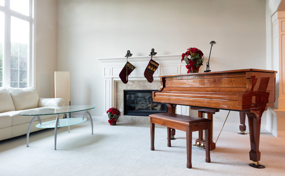 Grand piano with Christmas decorations during the holiday season