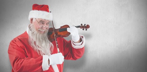 Composite image of smiling santa claus playing violin