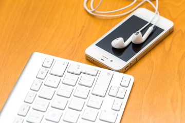 Close up of cellphone lying on wooden table