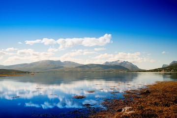 Fototapeta premium Norway hills with clouds reflection landscape