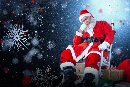 Composite image of santa claus relaxing on chair