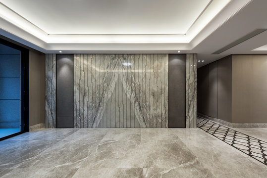 Empty room with marble flooring and wall decoration