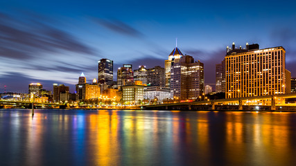Fototapeta na wymiar Pittsburgh downtown skyline at dawn viewed from North Shore Riverfront Park across Allegheny River.