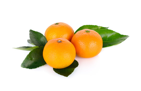 whole ripe orange with leaf on white background