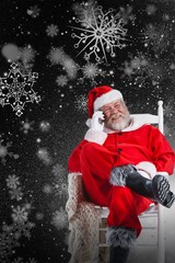 Composite image of santa claus talking on mobile phone