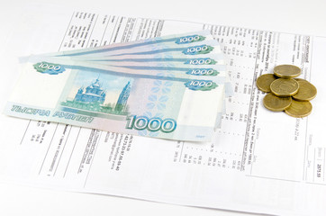 Receipt for utilities and russian money rubles on a white background
