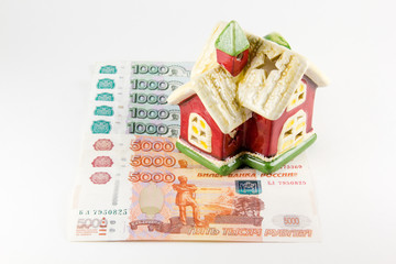 House and russian ruble money on white background