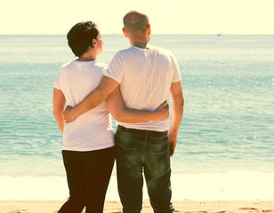 couple holding each other on the beach