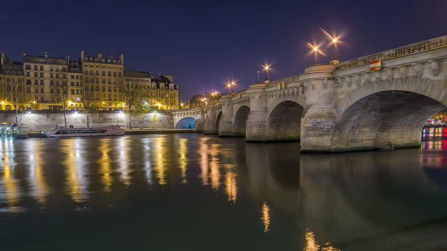 Paris, France: Seine river and the old town at night
