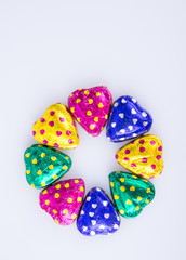 Chocolate or Colorful heart shape chocolate on a background.