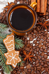 Fresh gingerbread, cup of coffee and grains, spices, christmas time