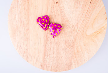 Chocolate or Colorful heart shape chocolate on a background.